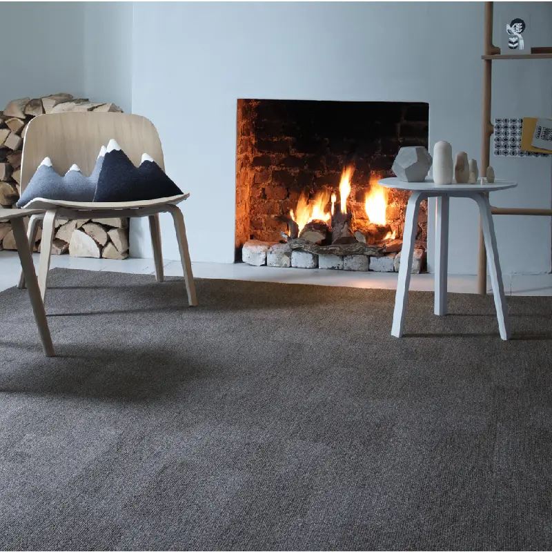 close-up of a charcoal-colored fireproof carpet in a cozy living room