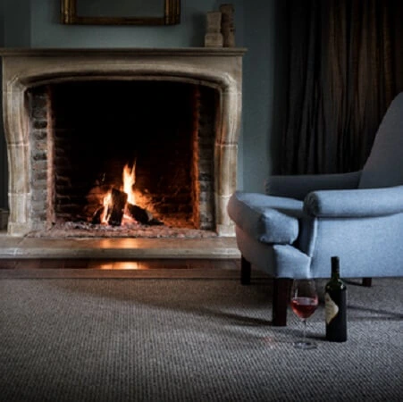 loop-pile fireproof carpet in a neutral grey tone