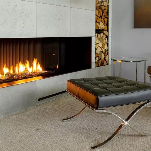 textured fireproof carpet in a modern room featuring an expansive linear gas fireplace