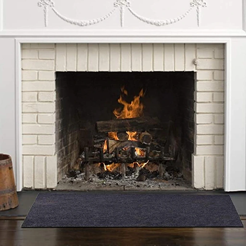 traditional wood-burning fireplace with a brick interior and a white mantel