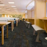Dark patterned fireproof carpet in a university study area.