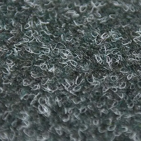 Forest green high-pile shag carpet with a dense, curly loop texture.