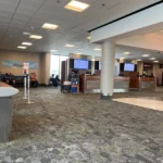 Grey patterned fireproof carpet in an airport terminal waiting area.