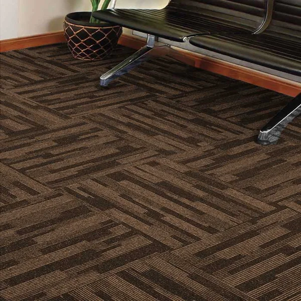 Brown patterned carpet tiles under a bench
