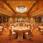 Red and gold patterned fireproof carpet in a formal banquet room.