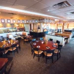 textured fireproof carpet in a warm, traditional restaurant dining room.